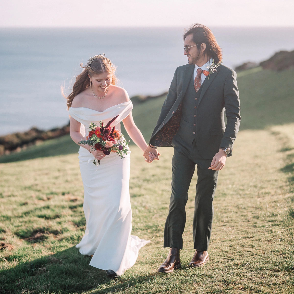 Rich autumnal colours in wildly romantic Bride's bouquets designed by Trelowen Flowers at Tredudwell Manor in South East Cornwall, a coastal wedding