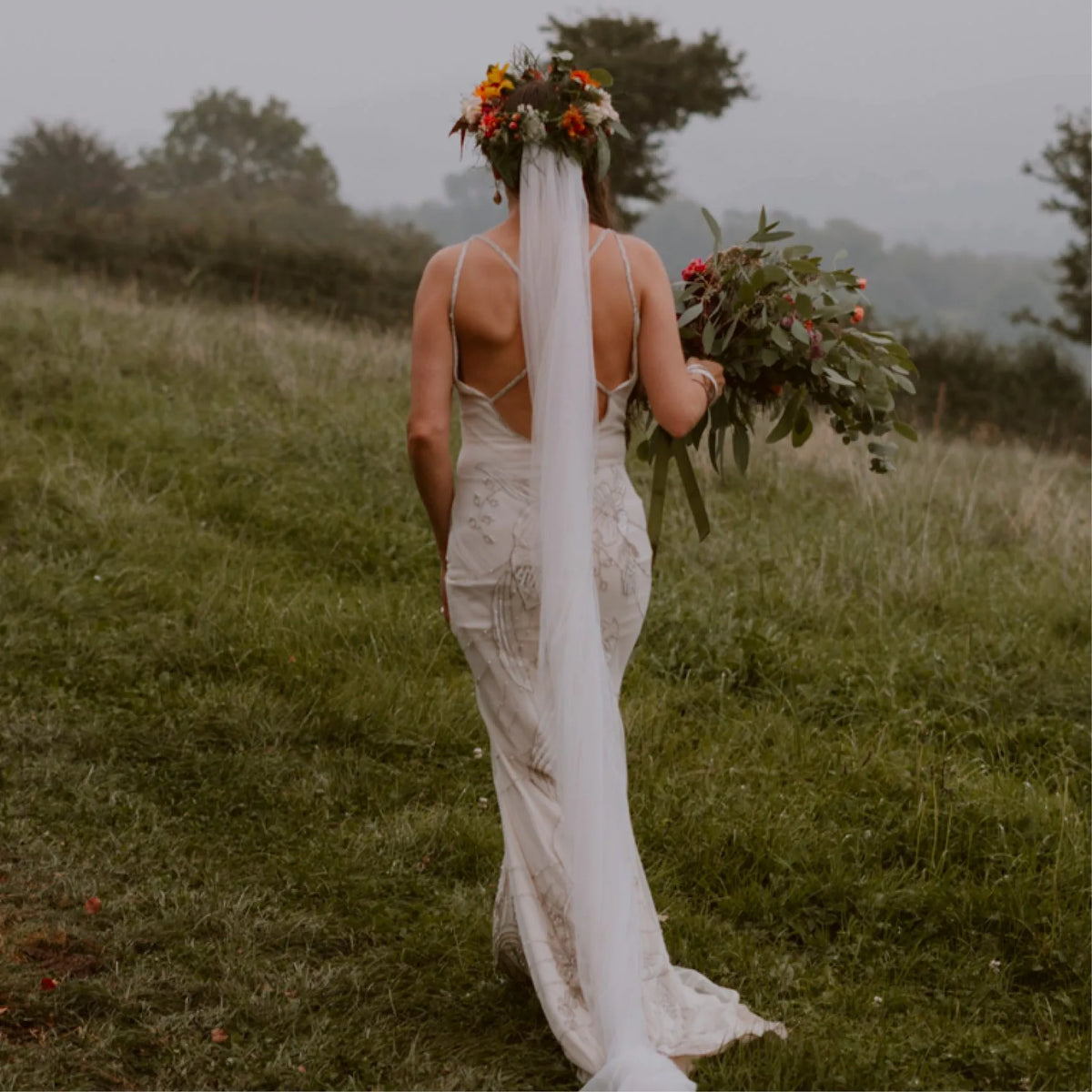 A wild garden-gathered bridal bouquet featuring seasonal Cornish  blooms an foliage grown on our flower farm for a wedding at The Green Cornwall